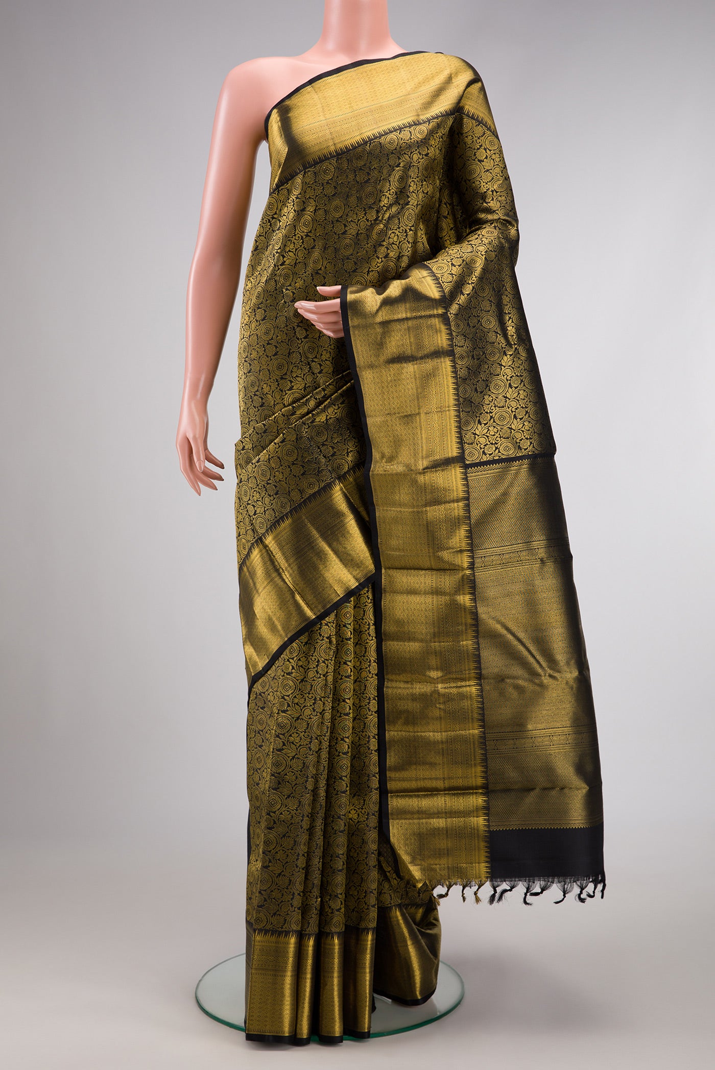 Pure Silk Pure Zari Black Dual Tone Kanjivaram Saree with Zari Brocade on the body and Zari Border.  displayed on a mannequin