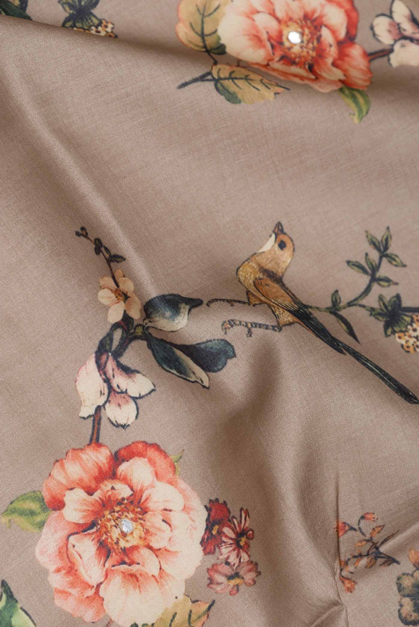 Close up of Brown Tussar Silk Saree with Floral Print on the body and Fancy Border displaying folds