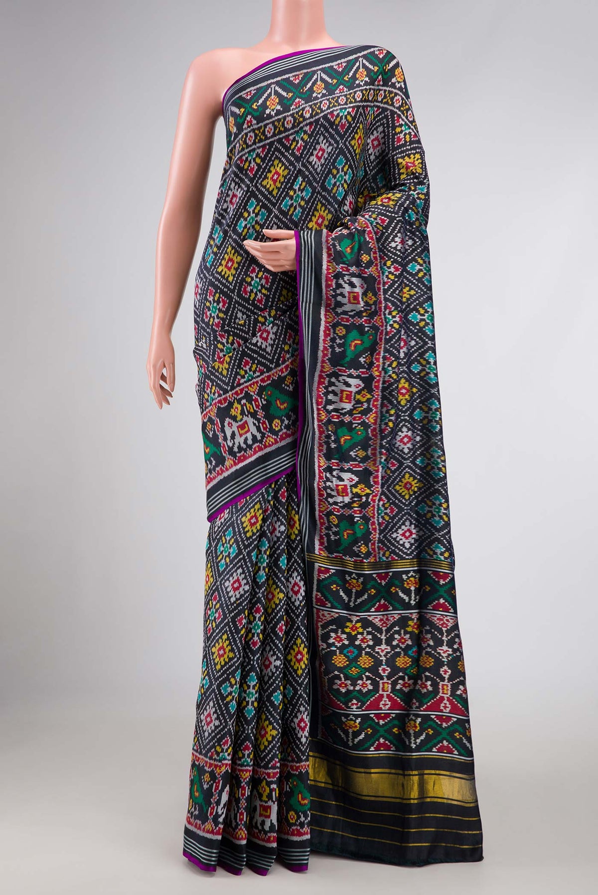 Black Pochampally Silk Saree with Pure Ikat on the body and Plain Border displayed on a mannequin