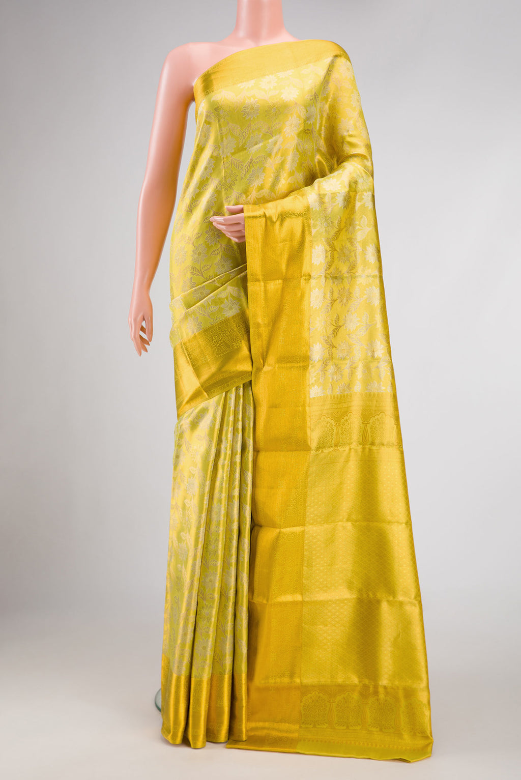 Lemon Yellow Dual Tone Kanchipuram Tissue Silk Saree with Zari Brocade on the body and Zari Border.  displayed on a mannequin