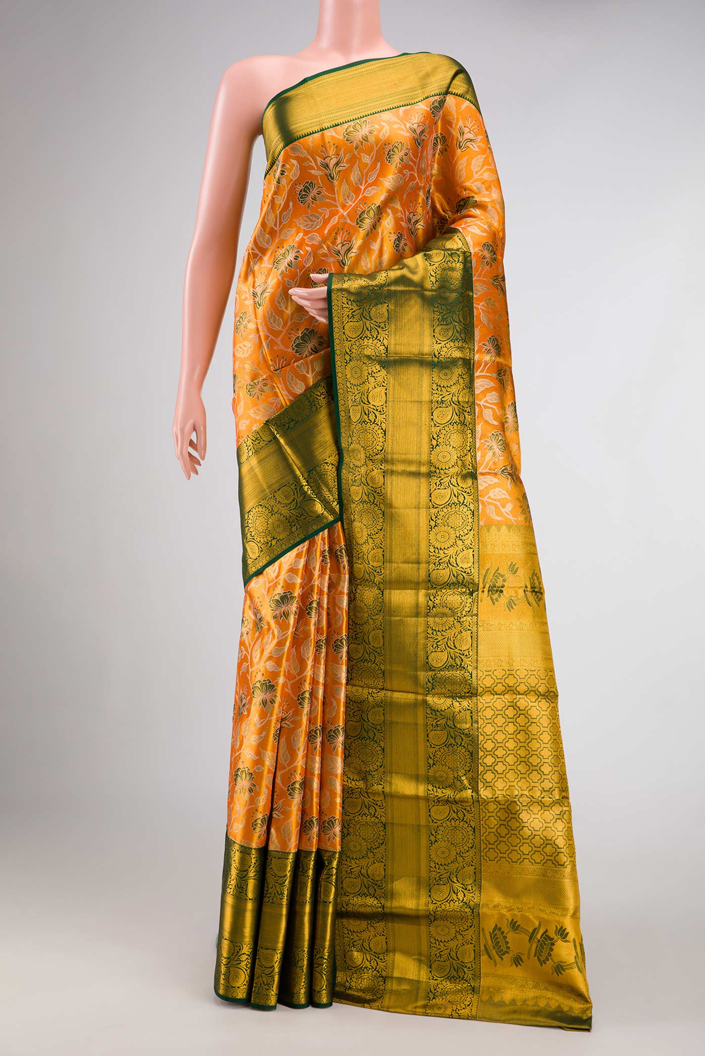 Orange Dual Tone Kanchipuram Tissue Silk Saree with Zari Brocade on the body and Zari Border.  displayed on a mannequin