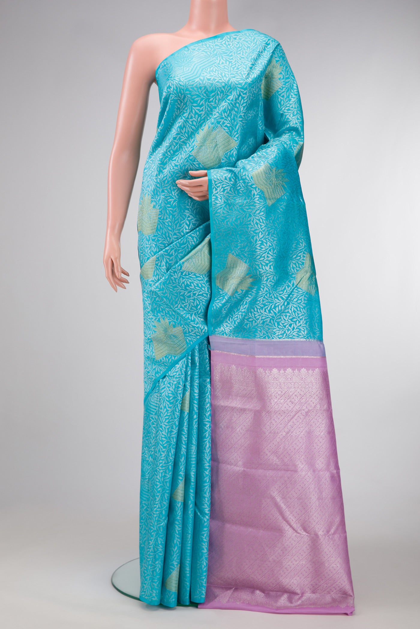 Sky Blue Dual Tone Kanjivaram Silk Saree with Zari Brocade on the body and Without Border.  displayed on a mannequin