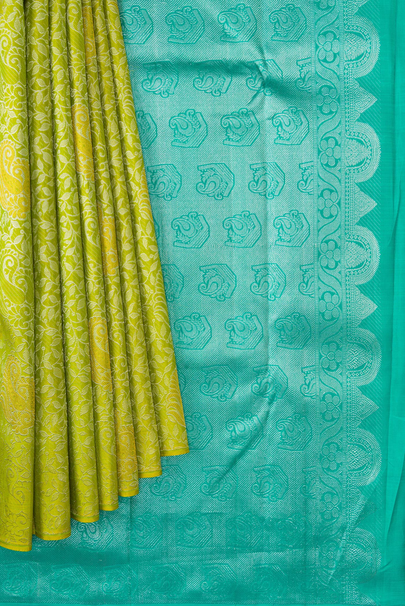 Pleats and pallu of Parrot Green Dual Tone Kanjivaram Silk Saree with Zari Brocade on the body and Without Border. 