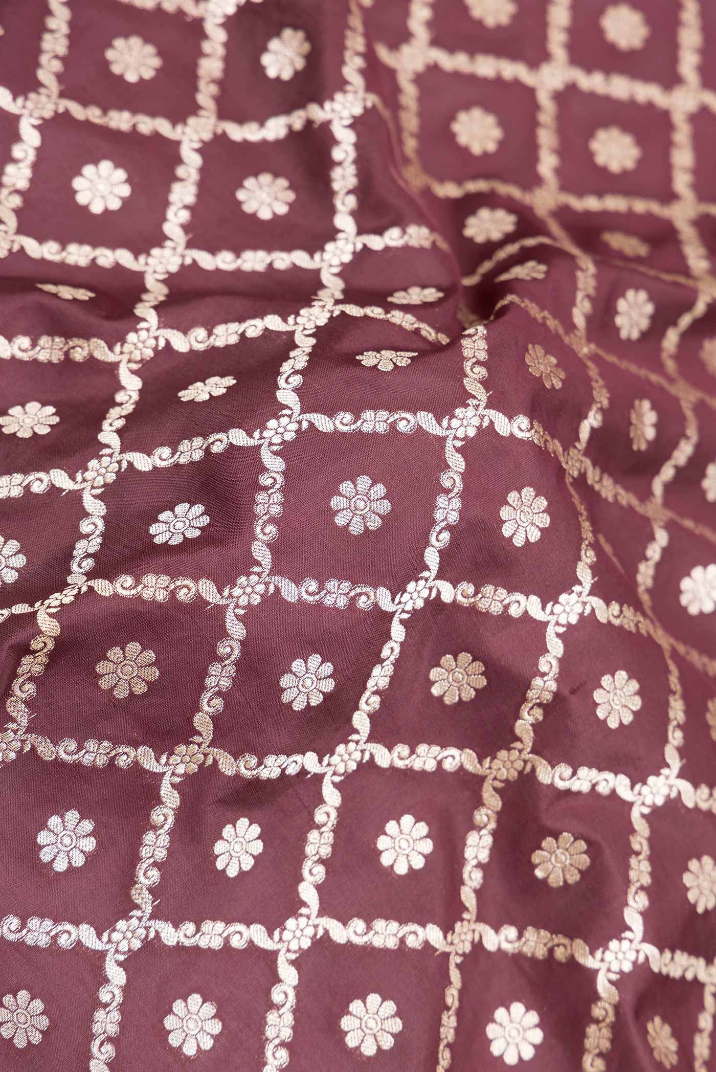 Close up of Brown Dual Tone Blended Banarasi Silk Saree with Zari Brocade on the body and Zari Border displaying folds