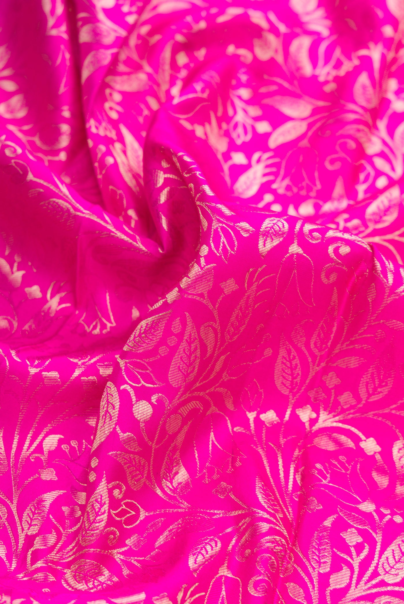 Close up of Pink Dual Tone Kanchipuram Silk Saree with Zari Brocade on the body and Zari Border.  displaying folds
