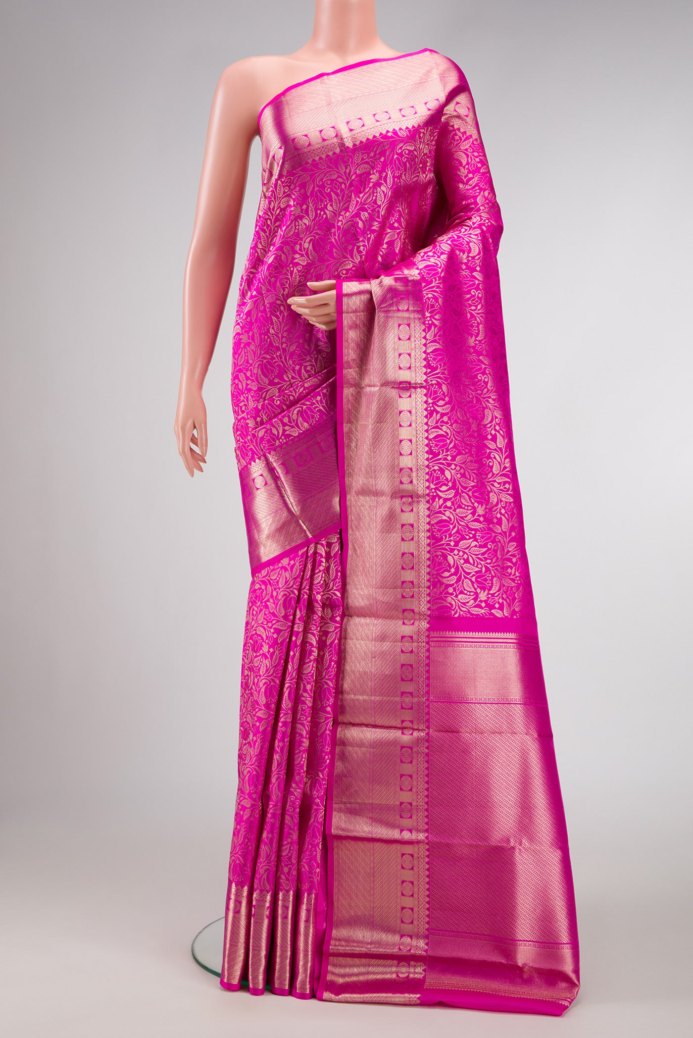 Pink Dual Tone Kanchipuram Silk Saree with Zari Brocade on the body and Zari Border.  displayed on a mannequin