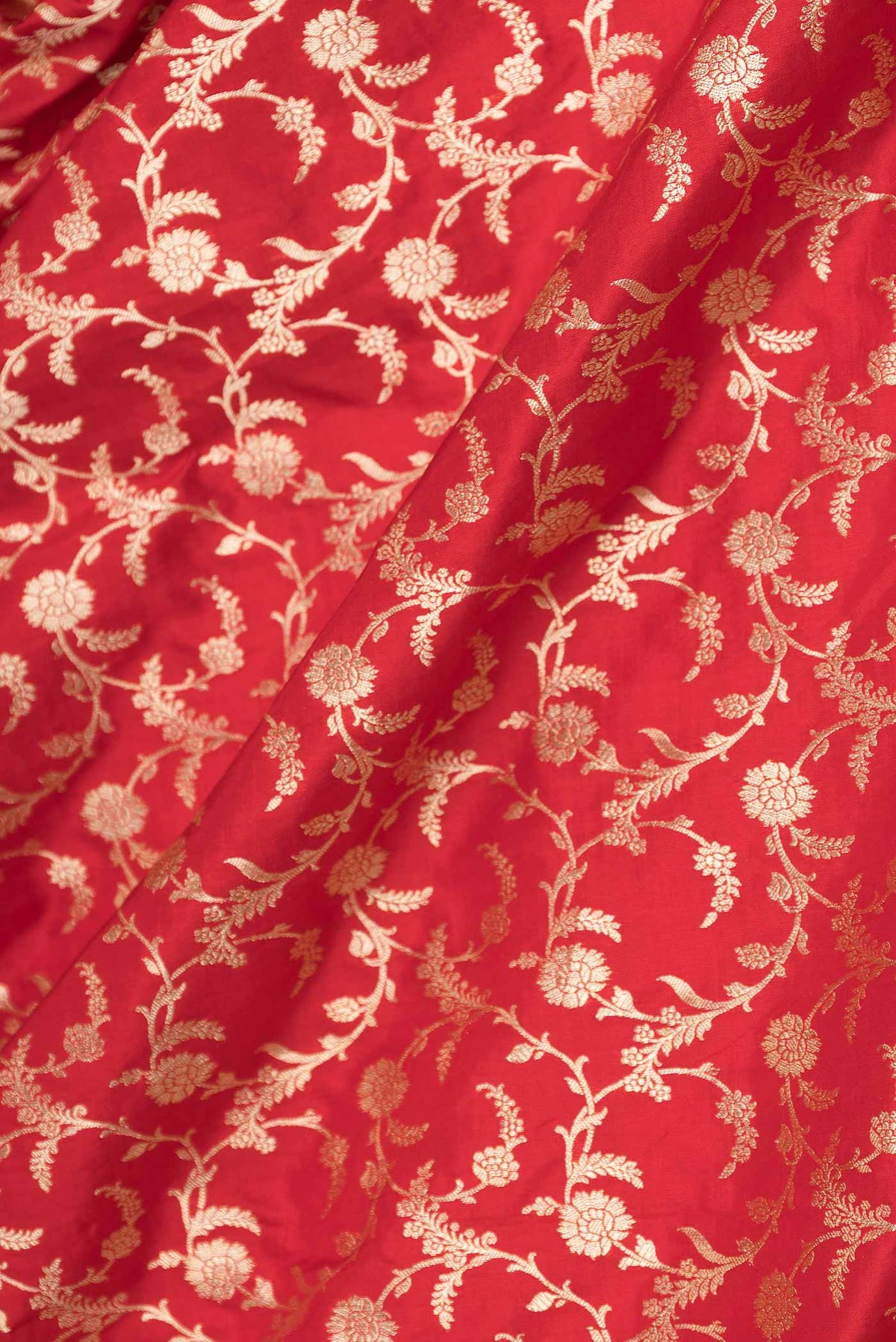 Close up of Red Dual Tone Banarasi Saree with Zari Brocade on the body and Zari Border displaying folds