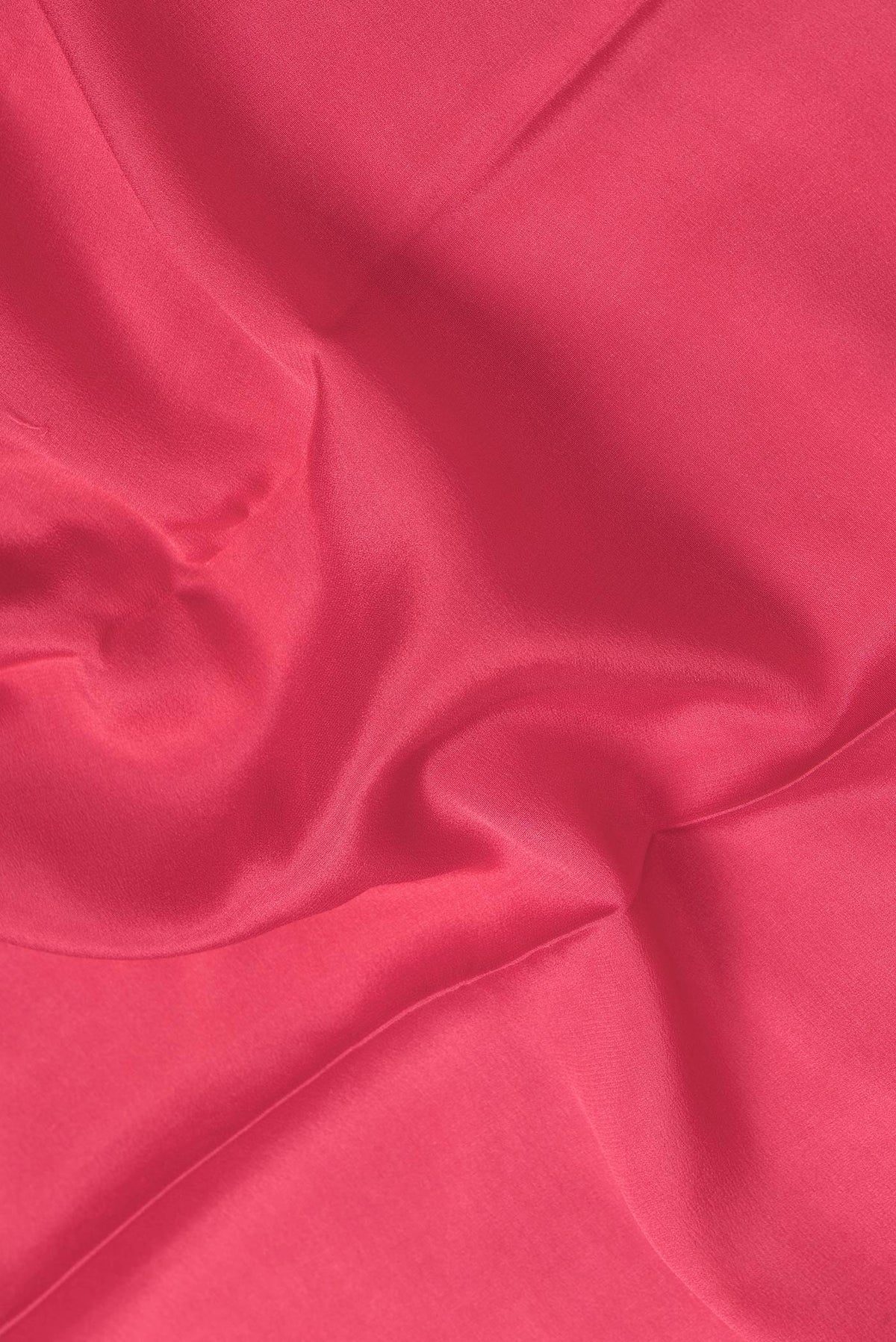 Close up of Pink Dual Tone Mysore Georgette Saree with Plain Body and Zari Border.  displaying folds