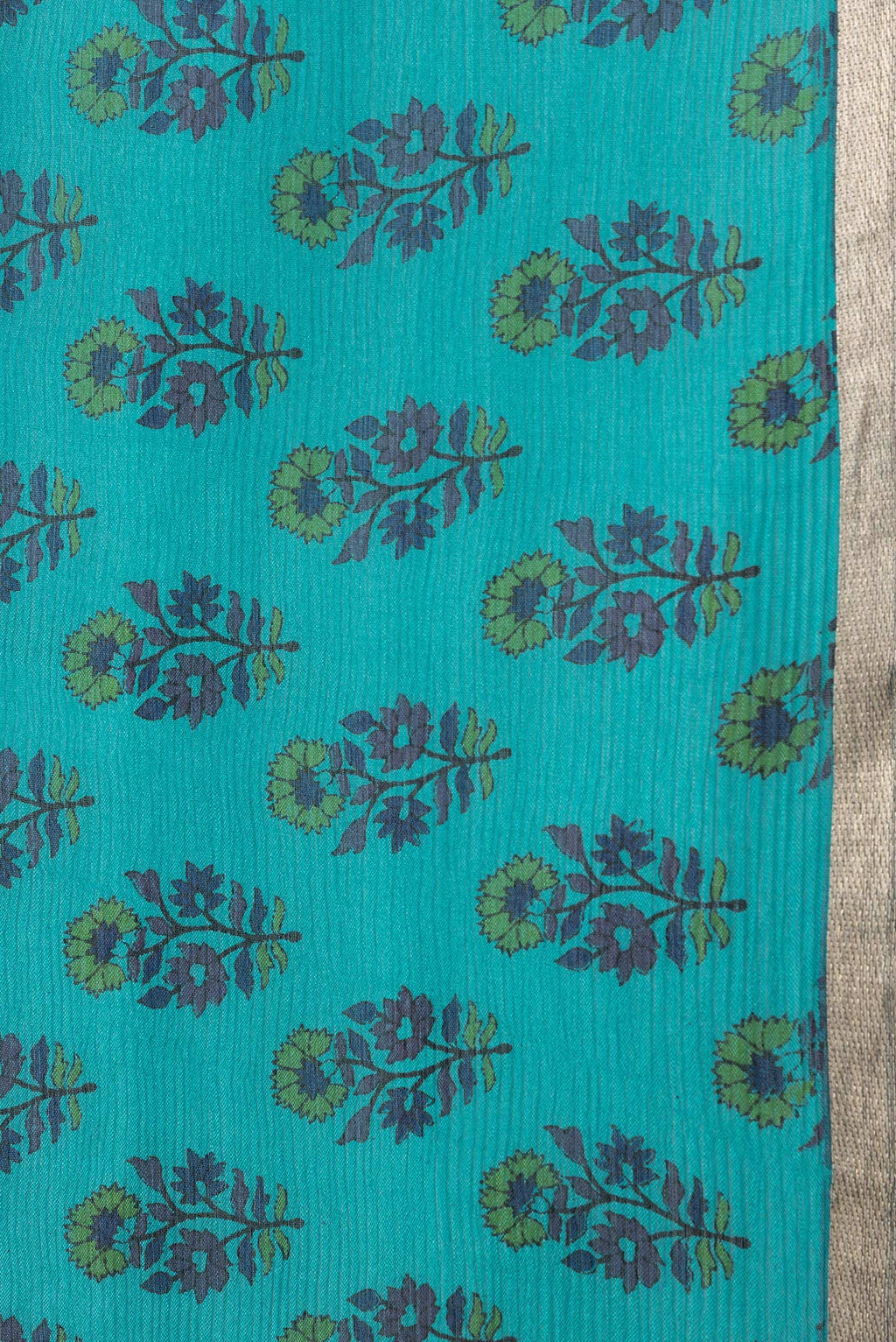 Border image of Sky Blue Dual Tone Mysore Chiffon Saree with Printed design on the body and Thin Zari Line. 