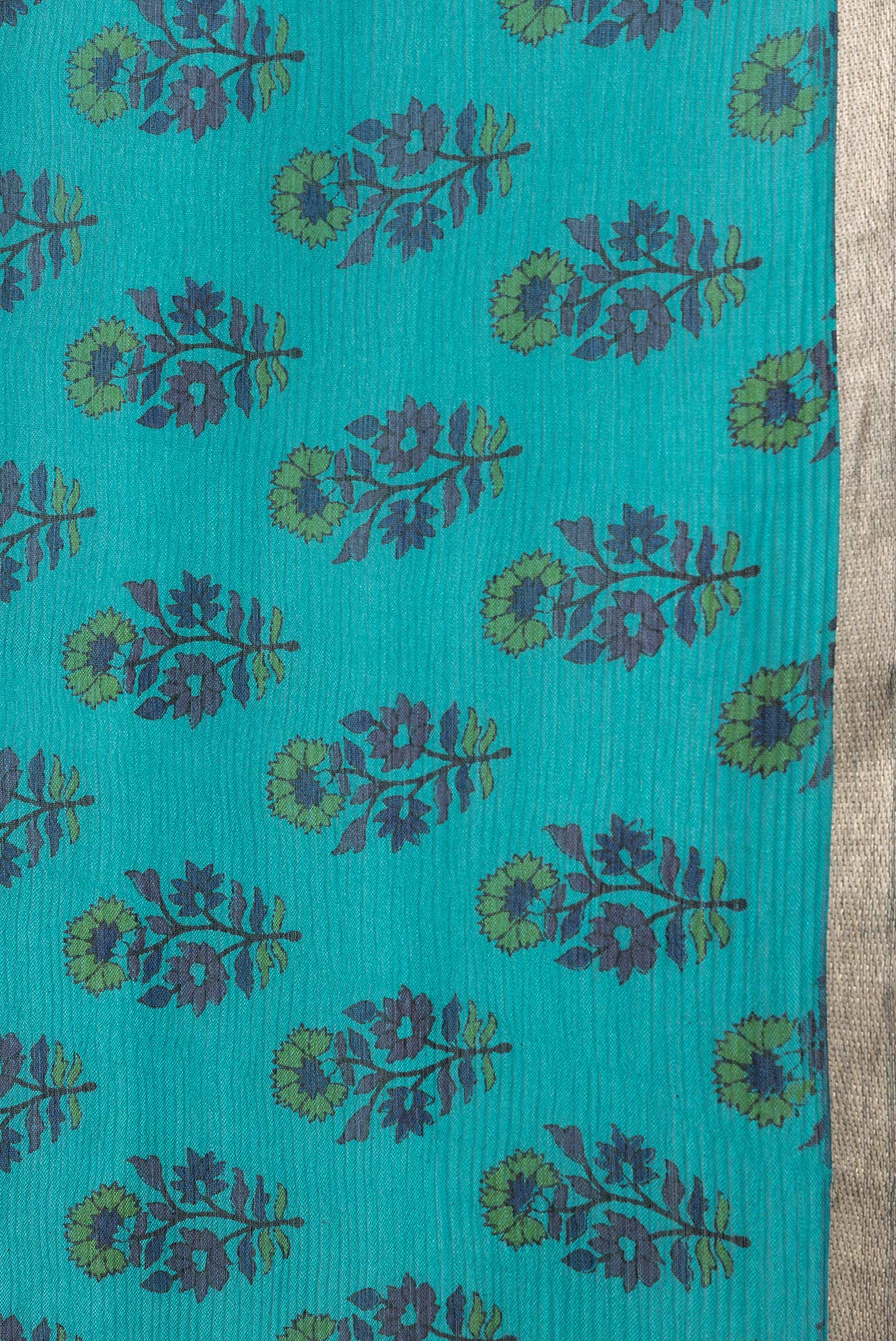 Border image of Sky Blue Dual Tone Mysore Chiffon Saree with Printed design on the body and Thin Zari Line. 