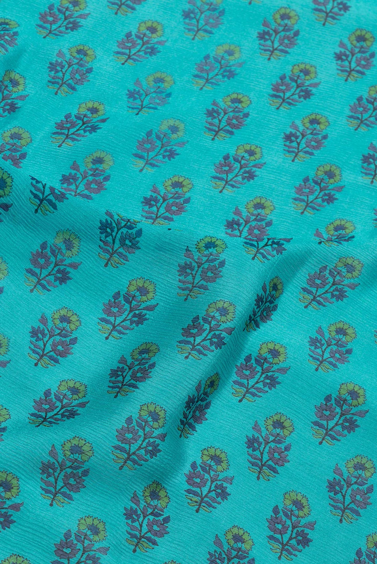 Close up of Sky Blue Dual Tone Mysore Chiffon Saree with Printed design on the body and Thin Zari Line.  displaying folds