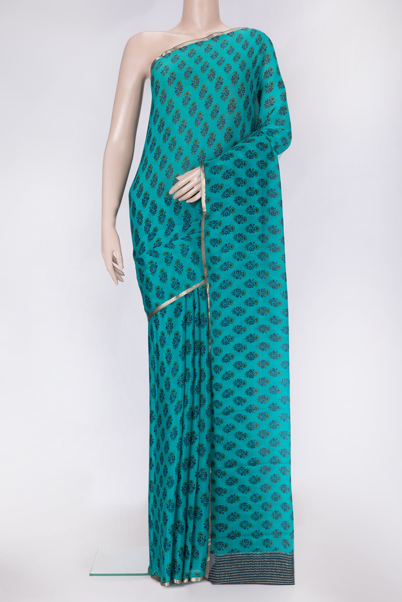 Sky Blue Dual Tone Mysore Chiffon Saree with Printed design on the body and Thin Zari Line.  displayed on a mannequin