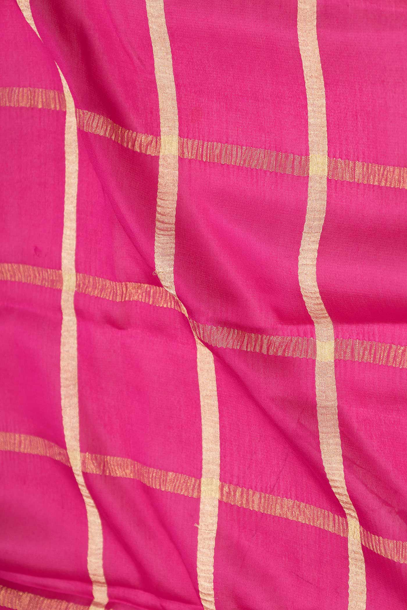 Close up of Pink Dual Tone Mysore Crepe Saree with Checked design on the body and Zari Border displaying folds