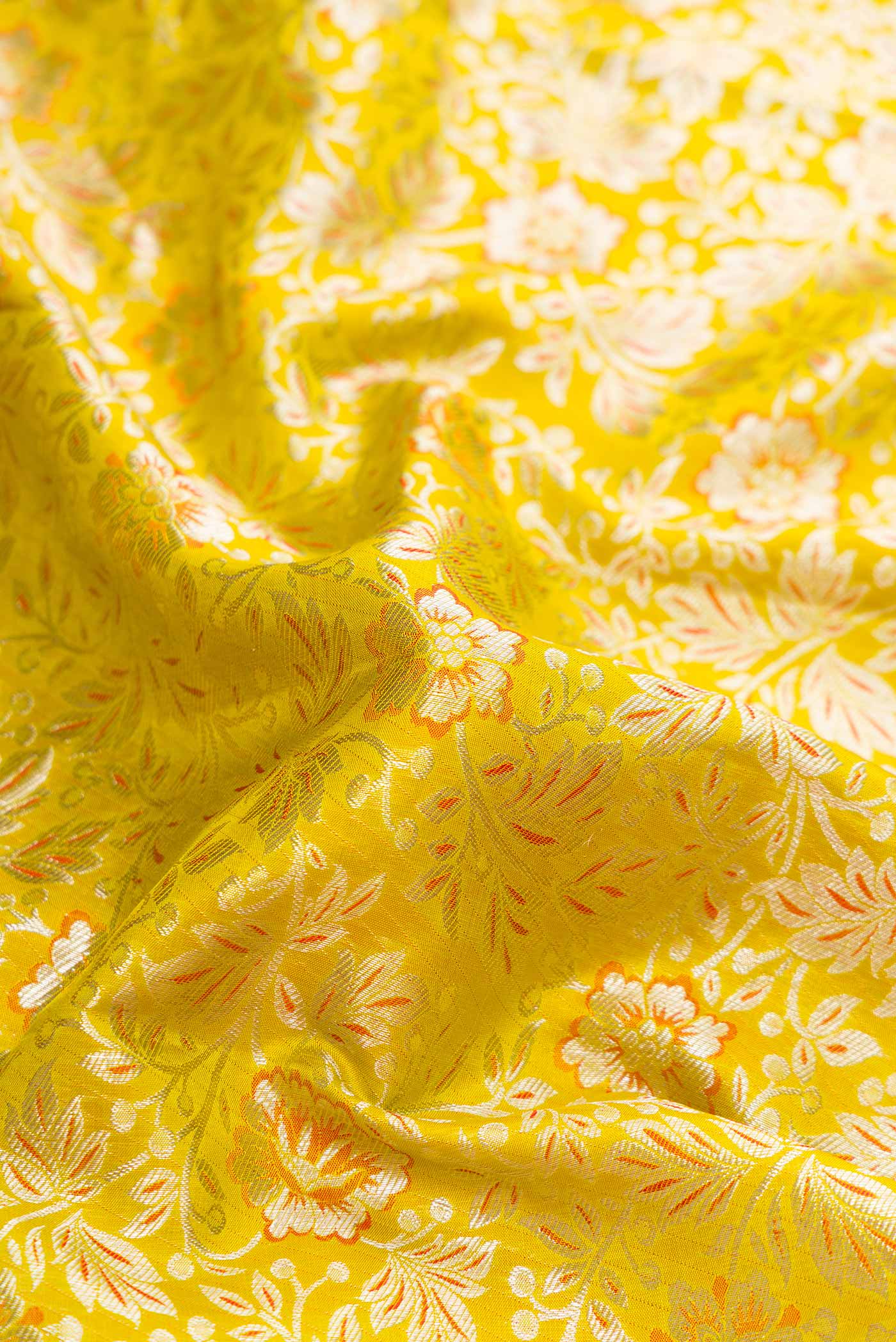Close up of Parrot Green Dual Tone Kanjivaram Silk Saree with Zari Brocade on the body and Zari Border.  displaying folds
