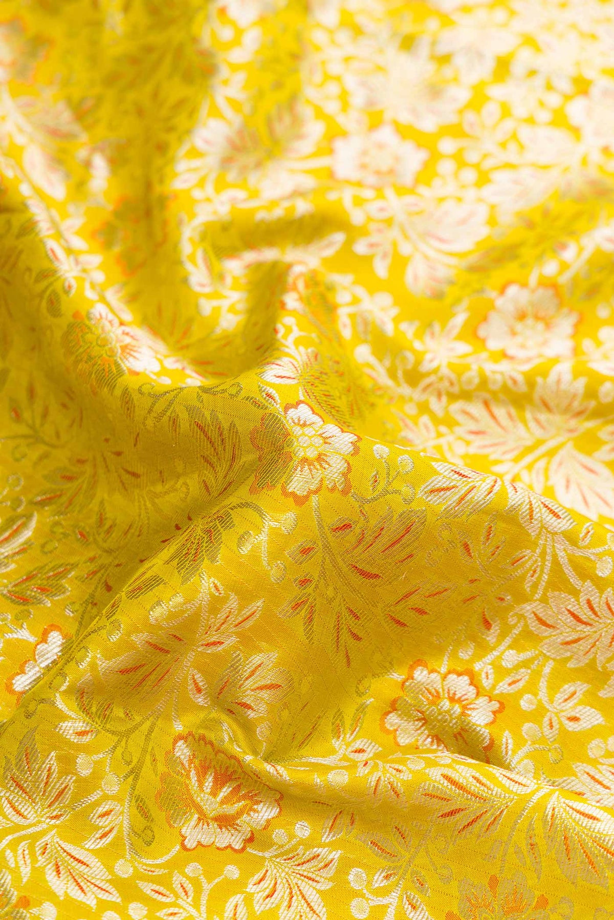 Close up of Parrot Green Dual Tone Kanjivaram Silk Saree with Zari Brocade on the body and Zari Border.  displaying folds