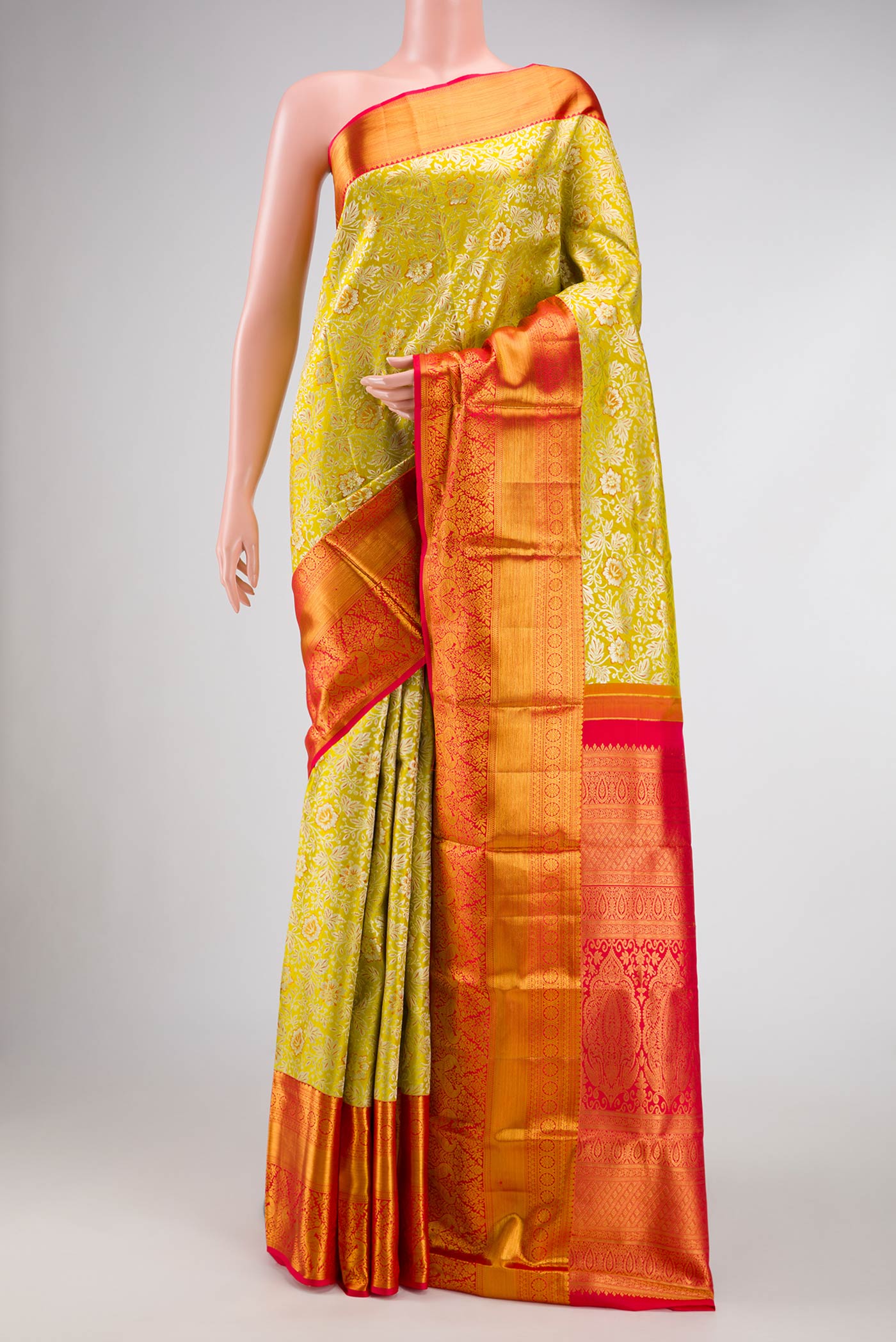 Parrot Green Dual Tone Kanjivaram Silk Saree with Zari Brocade on the body and Zari Border.  displayed on a mannequin