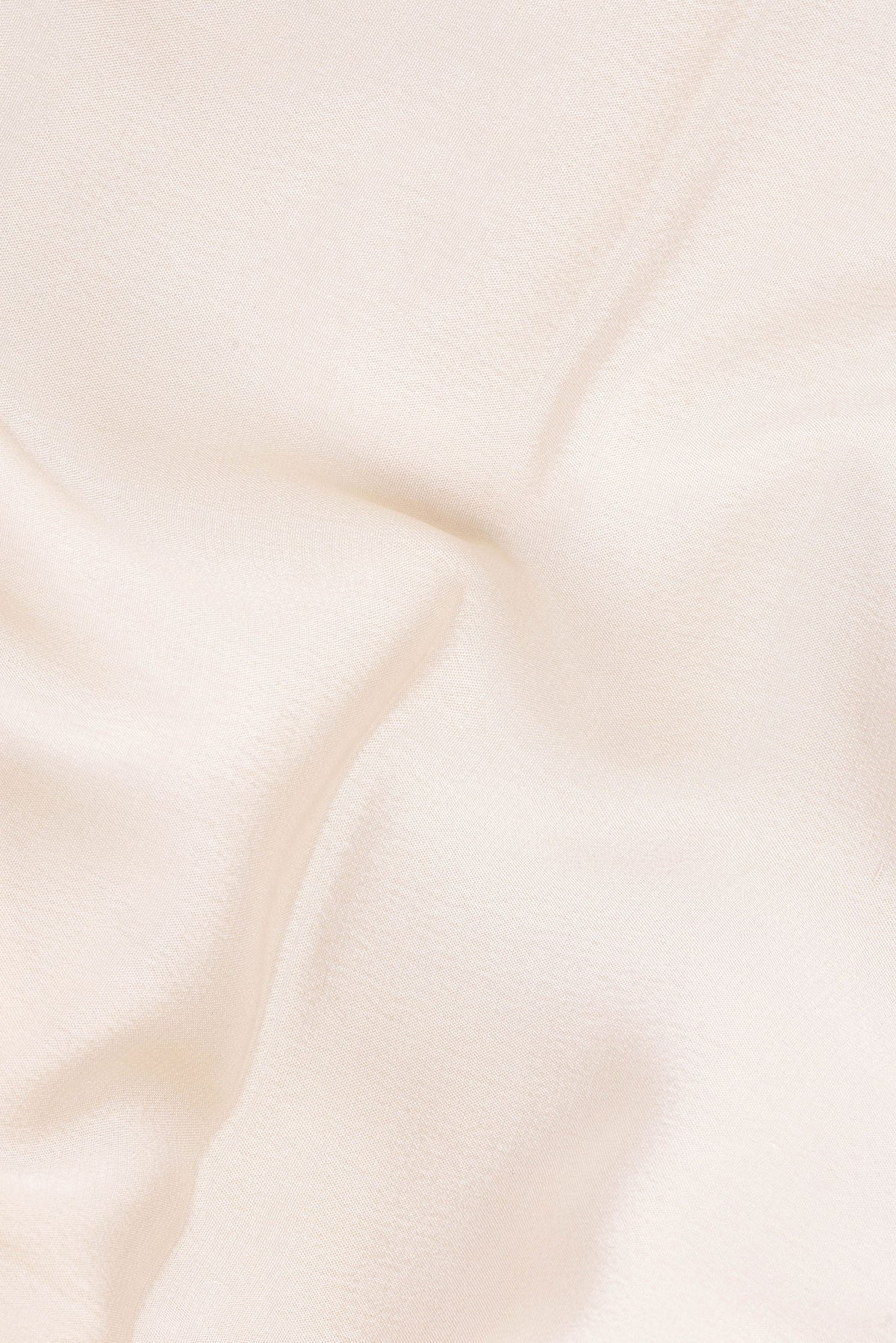 Close up of Cream Mysore Crepe Saree with Plain Body and Embroidery Border.  displaying folds