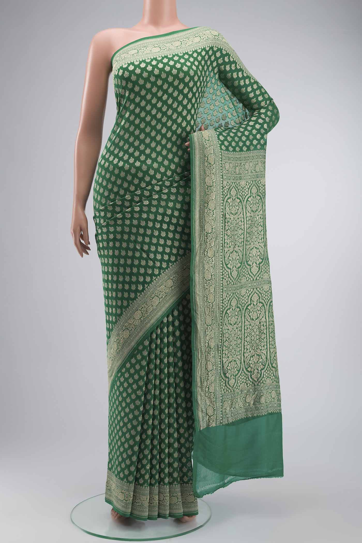 Green Banarasi Georgette Saree with Zari Butta on the body and Zari Border displayed on a mannequin