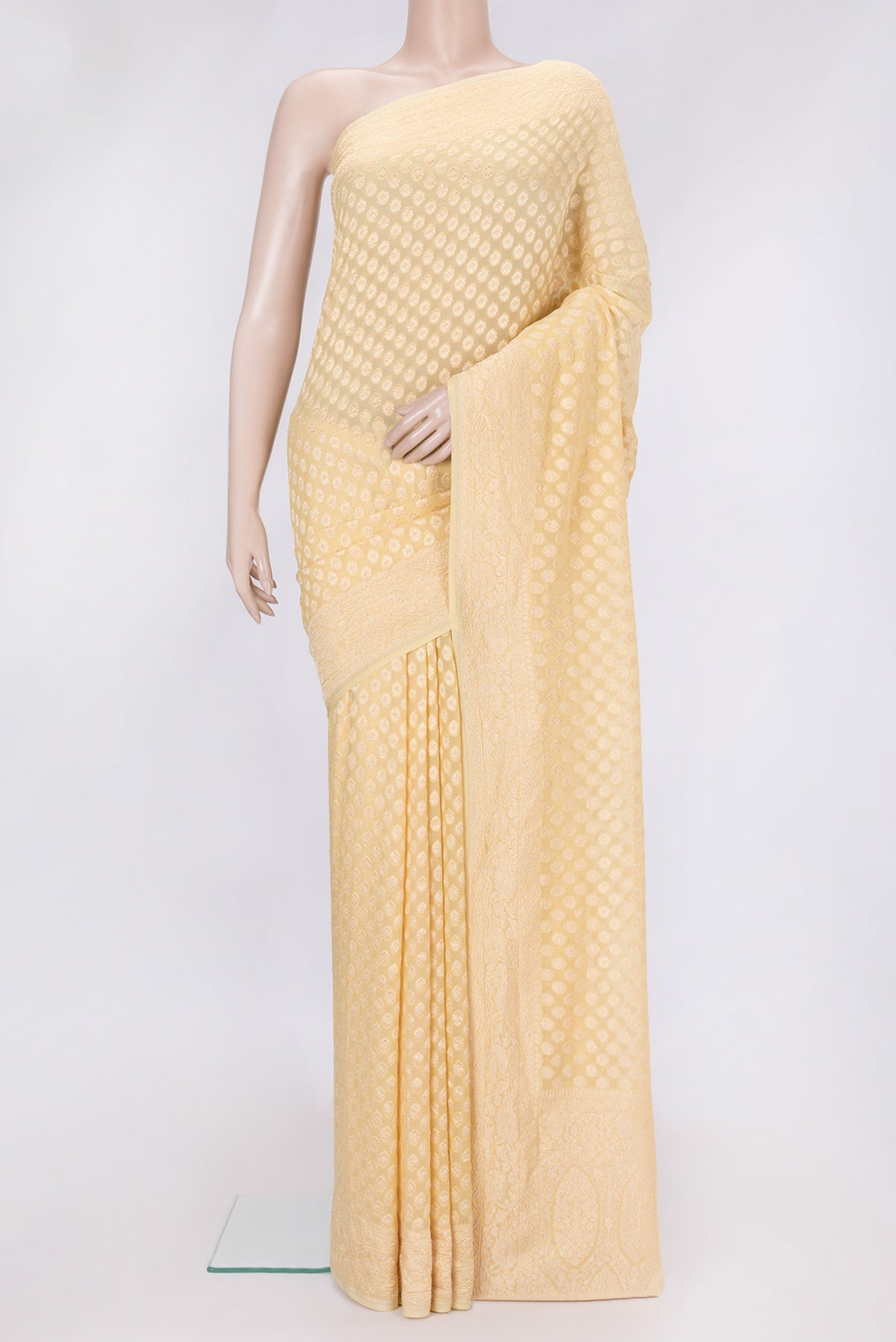 Sandal Dual Tone Banarasi Georgette Saree with Zari Brocade on the body and Zari Border.  displayed on a mannequin