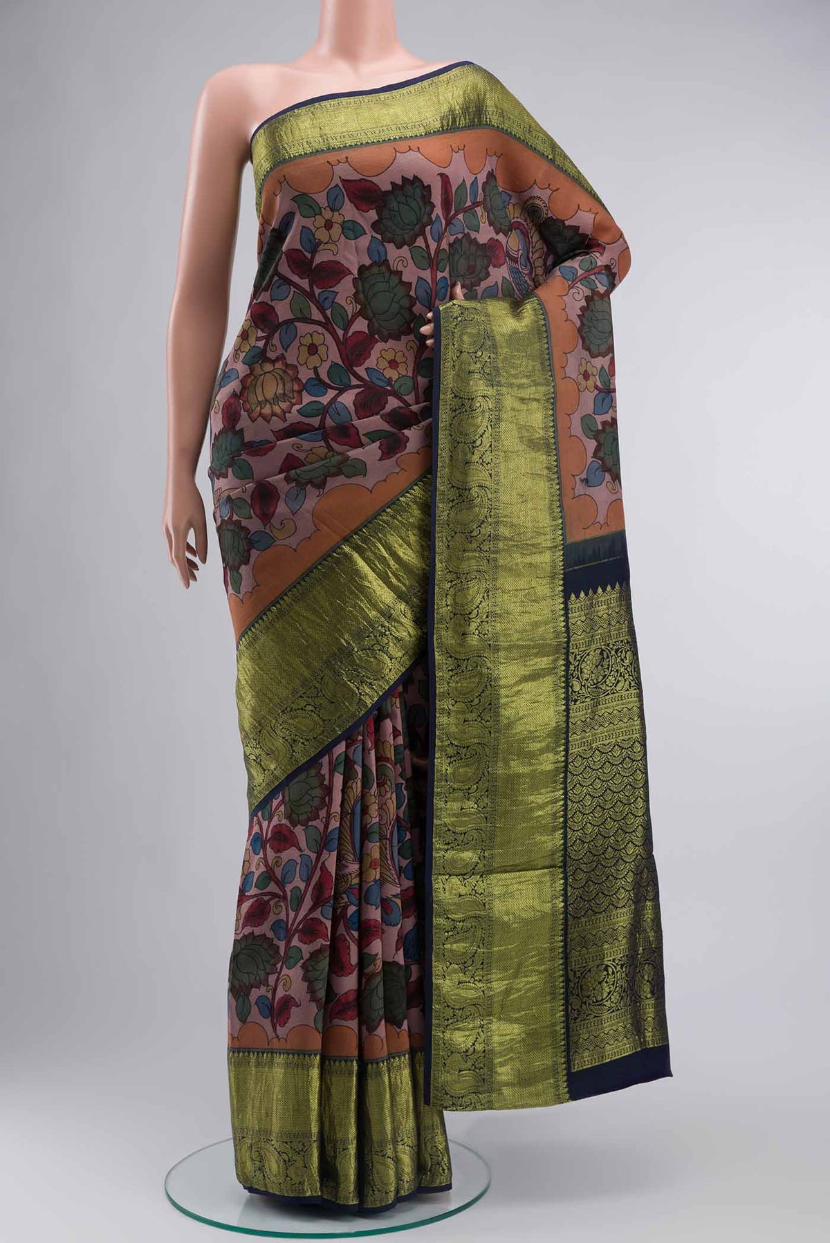 Mauve Kanchipuram Silk Saree with kalamkari Print on the body and Zari Border displayed on a mannequin