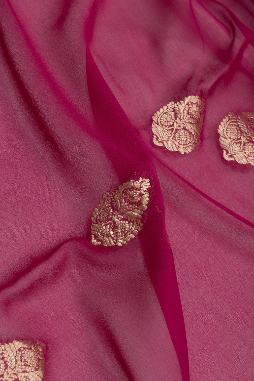 Close up of Magenta Mysore Georgette Saree with Zari Butta on the body and Zari Border.  displaying folds