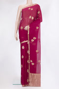 Magenta Mysore Georgette Saree with Zari Butta on the body and Zari Border.  displayed on a mannequin