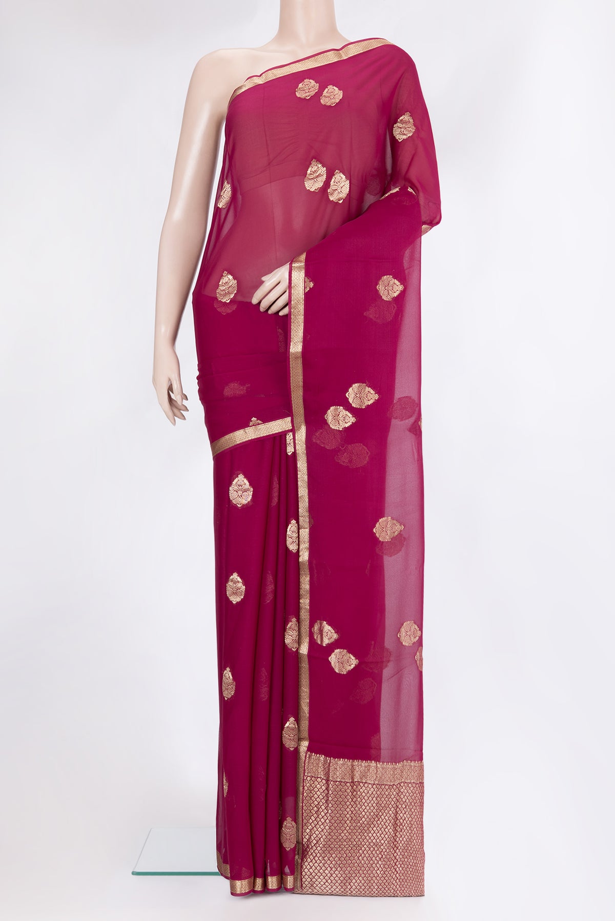 Magenta Mysore Georgette Saree with Zari Butta on the body and Zari Border.  displayed on a mannequin