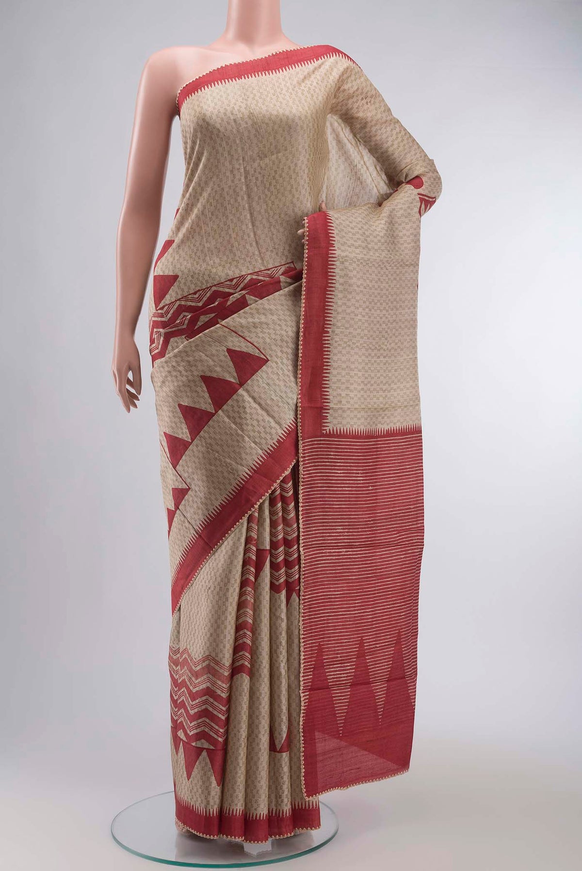 Beige Bhagalpuri Tussar Silk Saree with Printed design on the body and Embroidery Border displayed on a mannequin