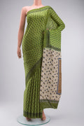 Green Tussar Silk Saree with Printed design on the body and Plain Border displayed on a mannequin