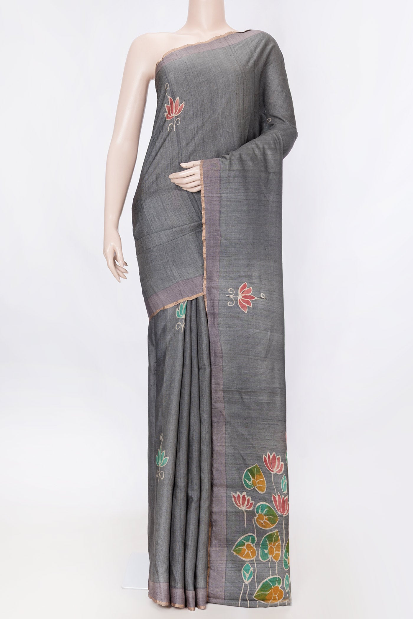 Grey Dual Tone Tussar Silk SareePrinted design on the body and Zari Border displayed on a mannequin