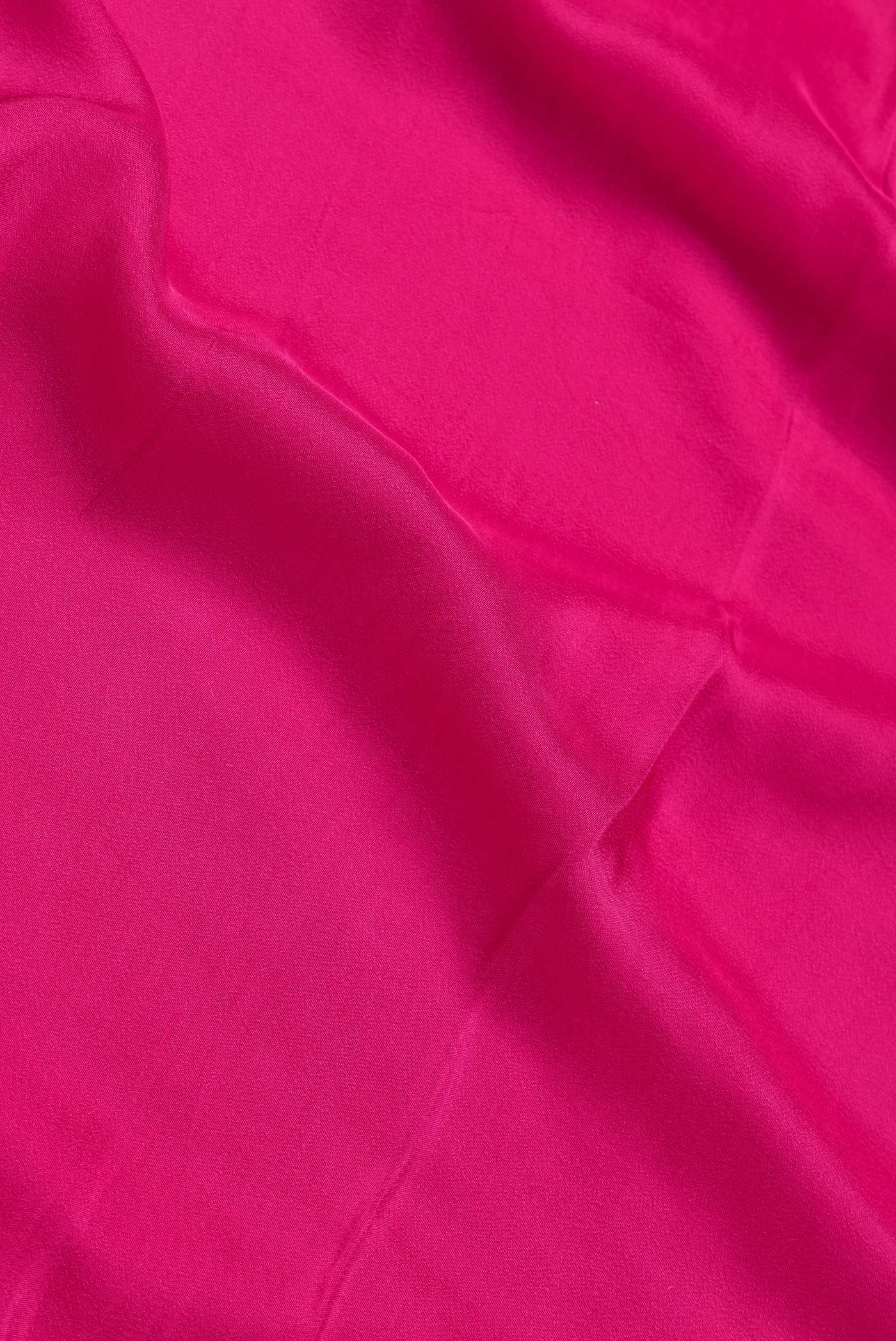 Close up of Pink Dual Tone Satin Crepe Saree with Plain Body and Sequin Border.  displaying folds