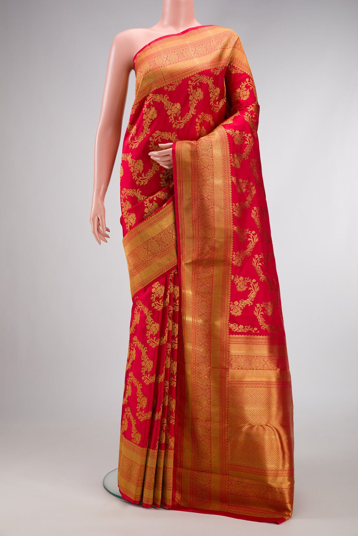 Pure Silk Pure Zari Red Dual Tone Kanjivaram Saree with Zari Brocade on the body and Zari Border.  displayed on a mannequin