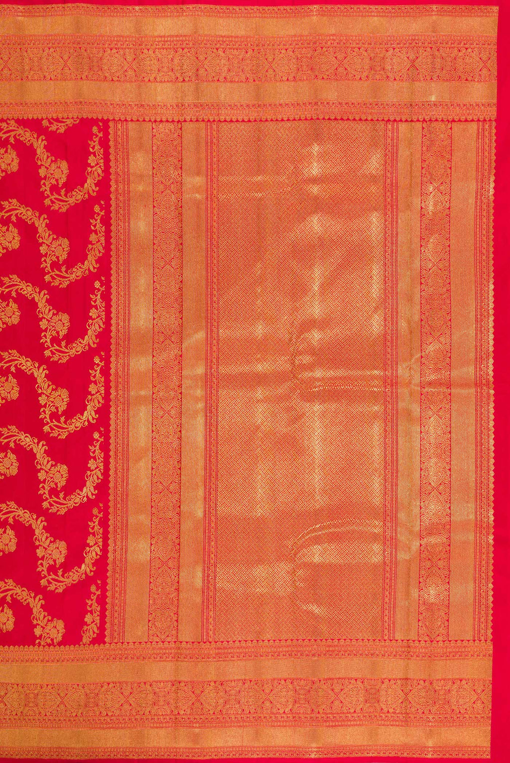 Close up image of the pallu of Pure Silk Pure Zari Red Dual Tone Kanjivaram Saree with Zari Brocade on the body and Zari Border. 