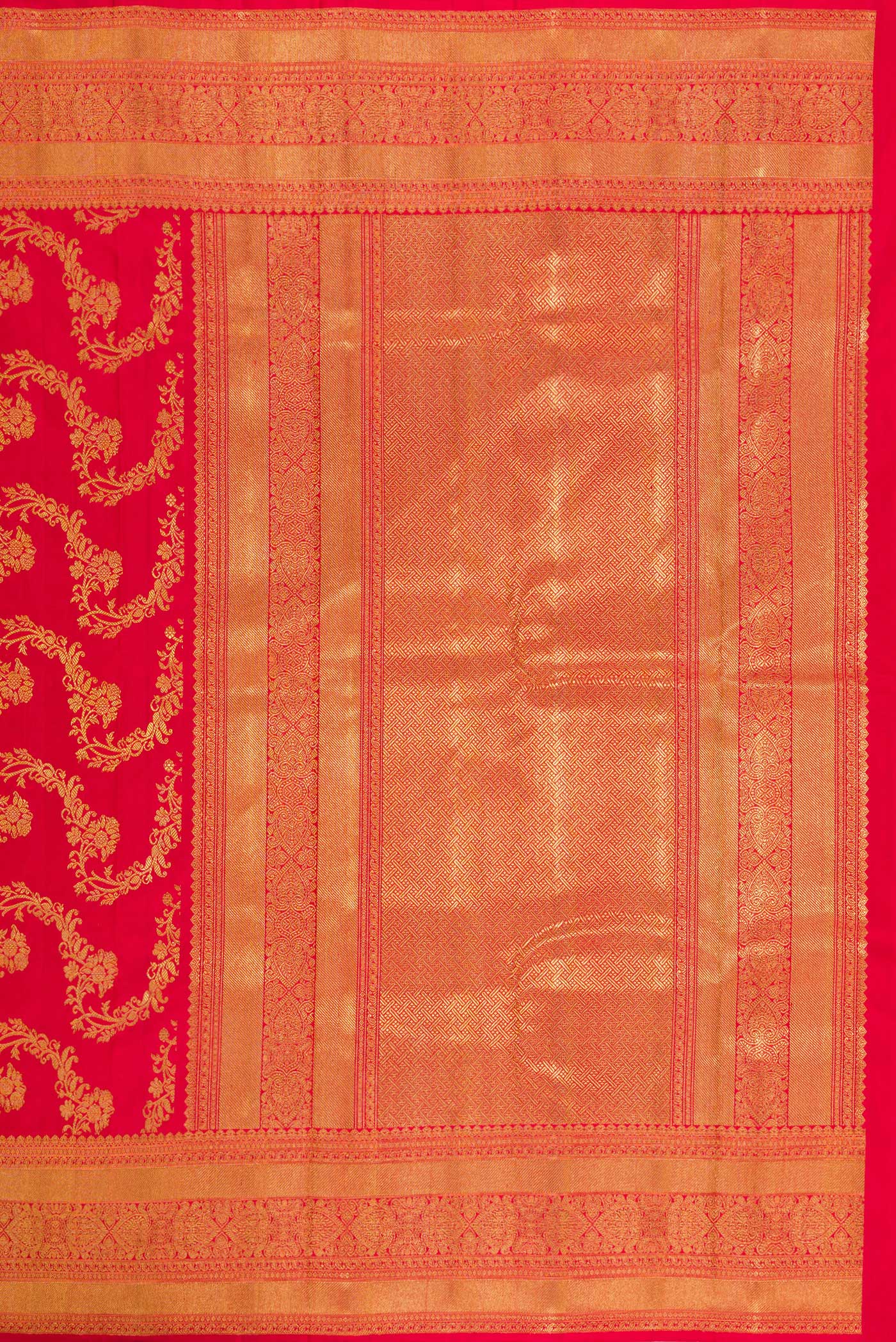 Close up image of the pallu of Pure Silk Pure Zari Red Dual Tone Kanjivaram Saree with Zari Brocade on the body and Zari Border. 