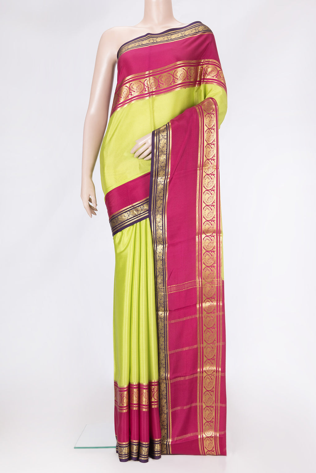 Parrot Green Dual Tone Mysore Silk Saree with Plain Body and Zari Border.  displayed on a mannequin