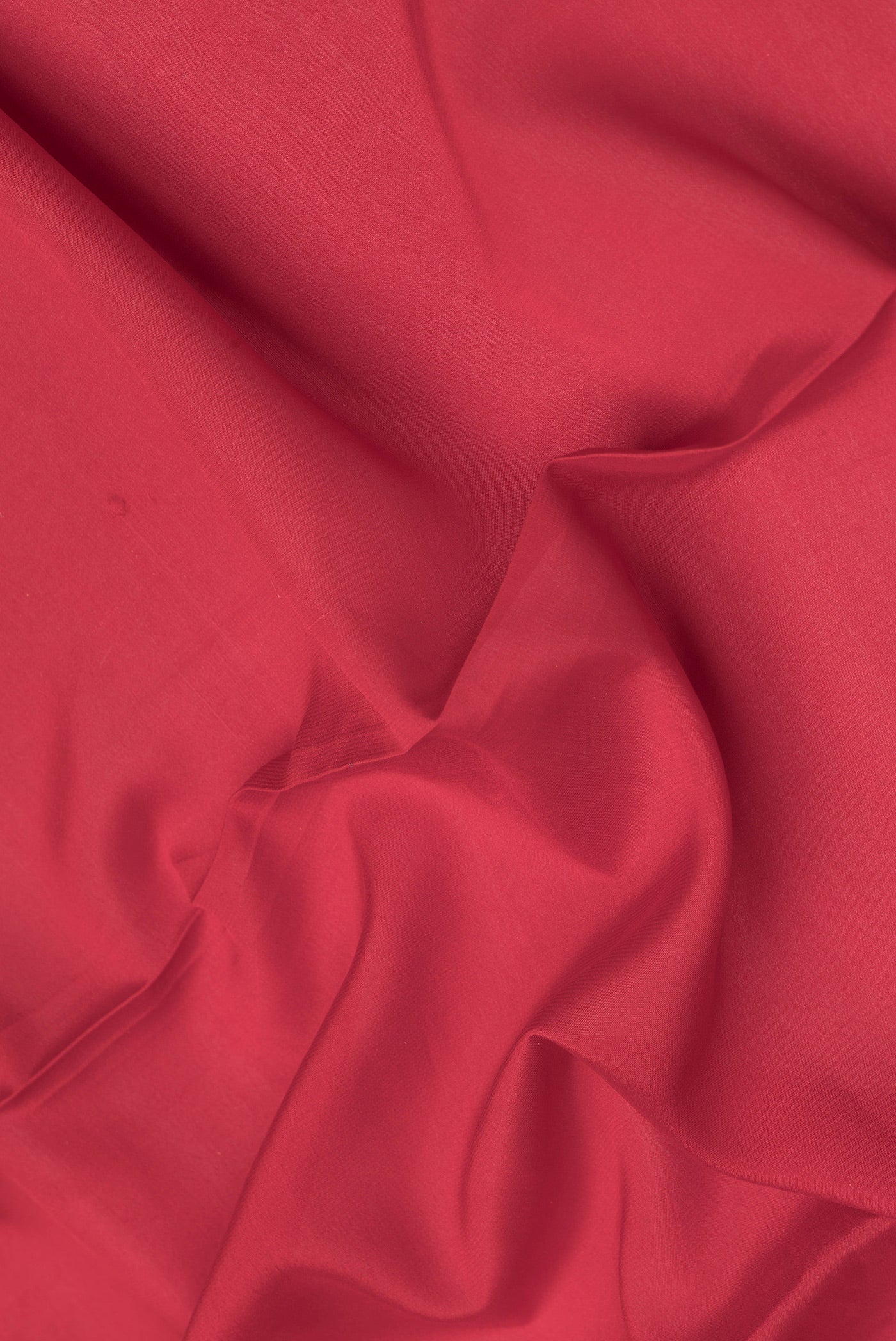 Close up of Red Dual Tone Mysore Silk Saree with Plain Body and Zari Border.  displaying folds