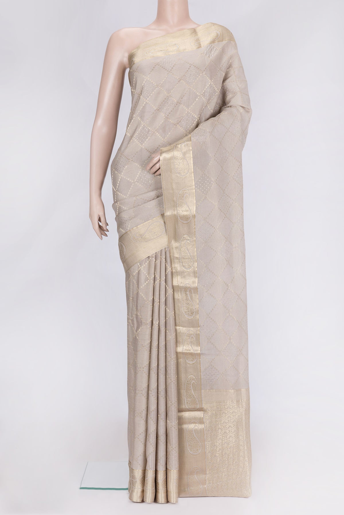 Beige Dual Tone Mysore Georgette Saree with Zari Brocade on the body and Zari Border.  displayed on a mannequin