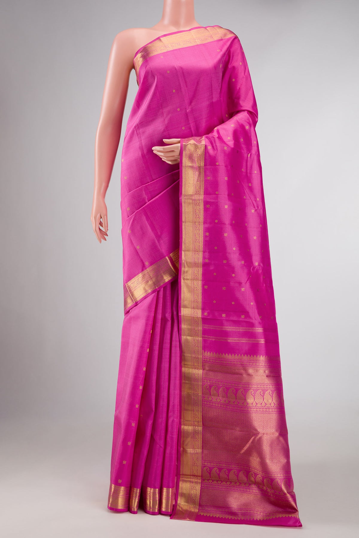 Pure Silk Pure Zari Rose pink Kanchipuram Saree with Zari Butta on the body and Zari Border displayed on a mannequin