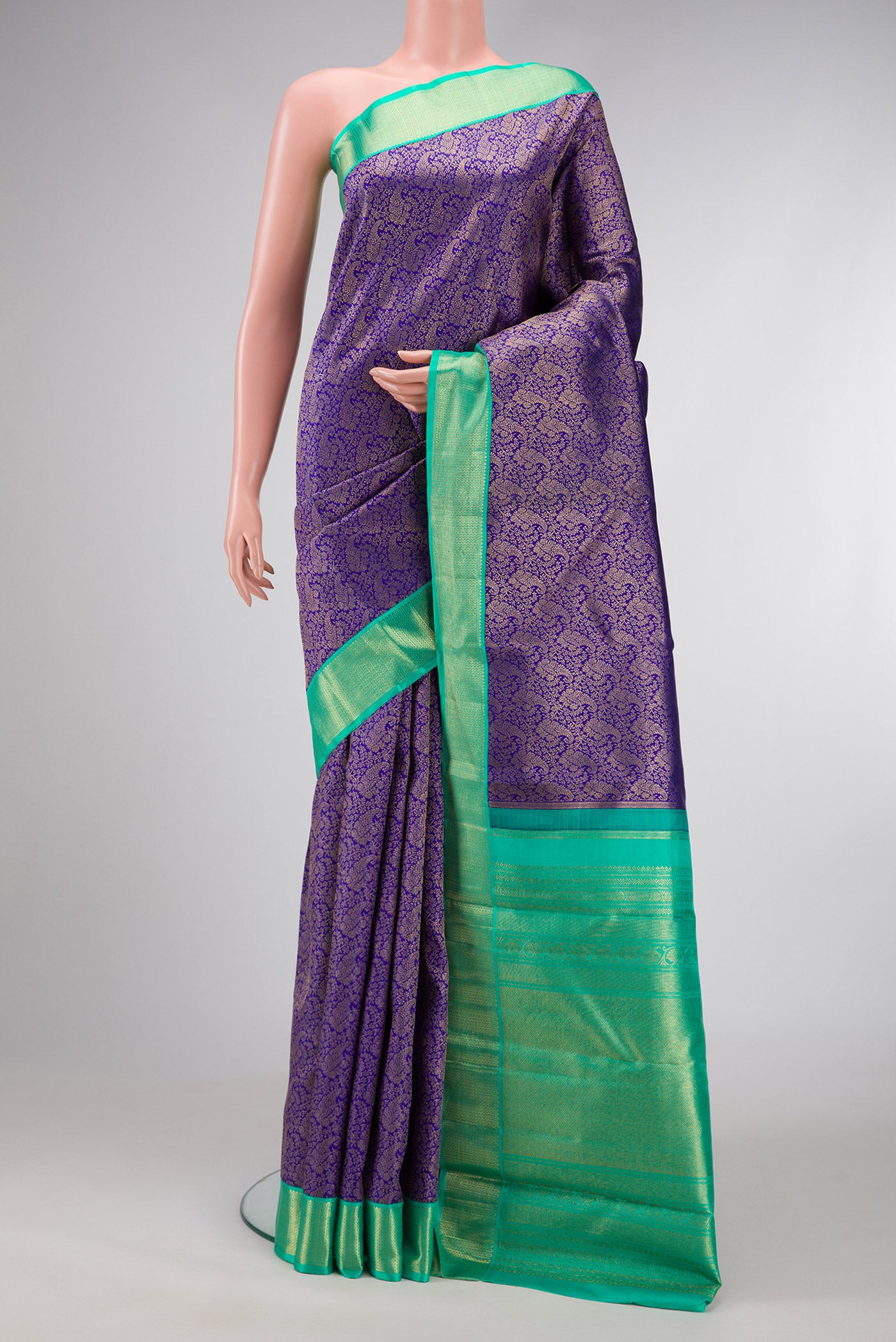 Pure Silk Pure Zari Royal Blue Dual Tone Kanjivaram Saree with Zari Brocade on the body and Zari Border.  displayed on a mannequin