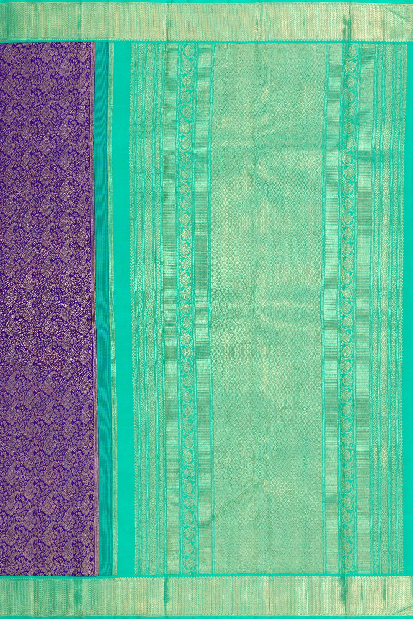 Close up image of the pallu of Pure Silk Pure Zari Royal Blue Dual Tone Kanjivaram Saree with Zari Brocade on the body and Zari Border. 