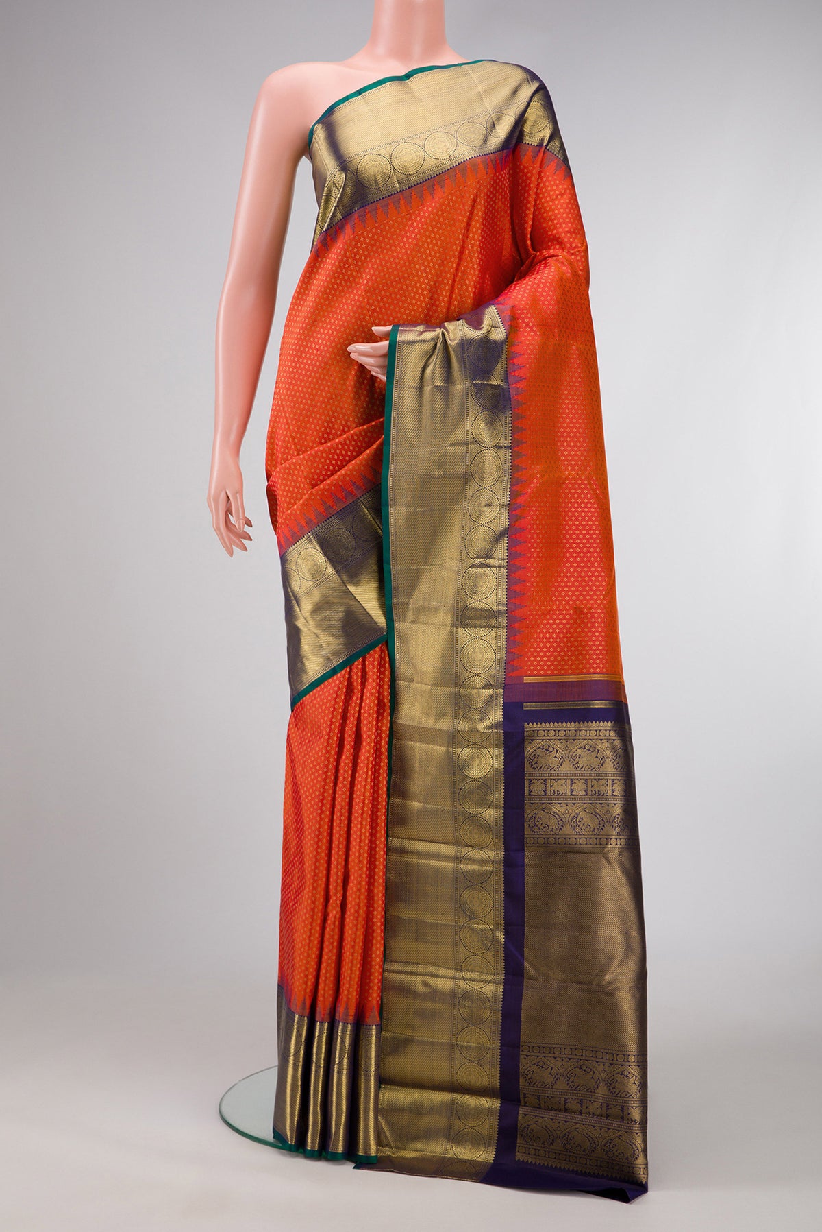 Pure Silk Pure Zari Orange Dual Tone Kanjivaram Saree with Zari Brocade on the body and Zari Border.  displayed on a mannequin