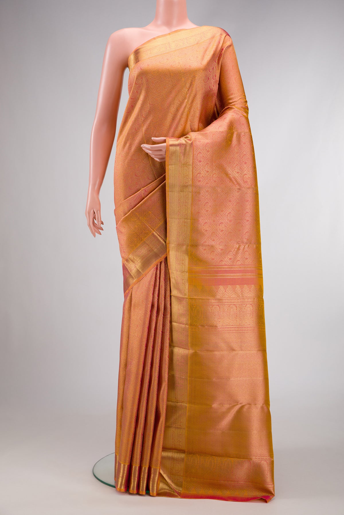 Pink Dual Tone Kanjivaram Silk Saree with Zari Brocade on the body and Zari Border.  displayed on a mannequin
