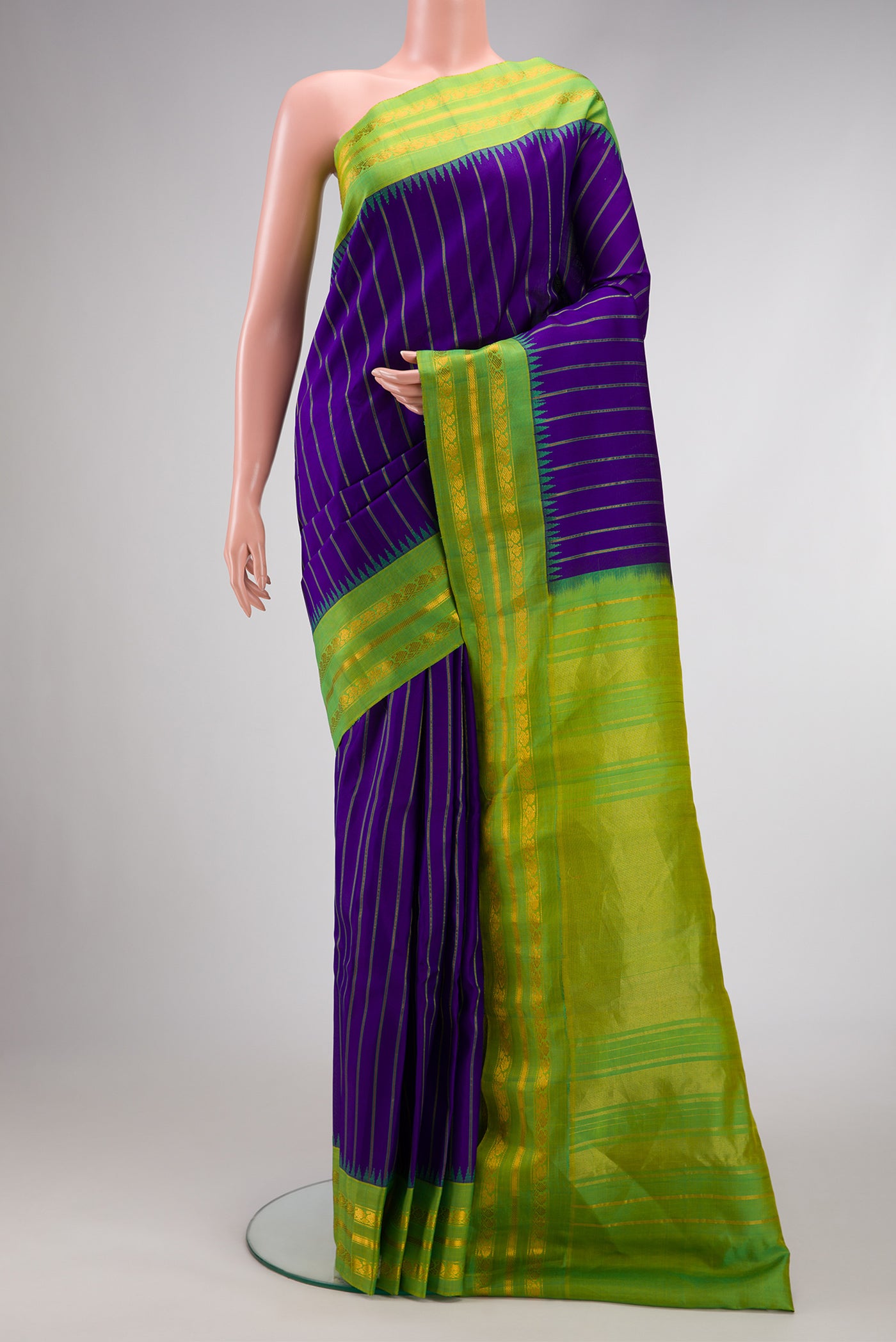 Royal Blue Dual Tone Gadwal Silk Saree with Stripes on the body and Zari Border.  displayed on a mannequin