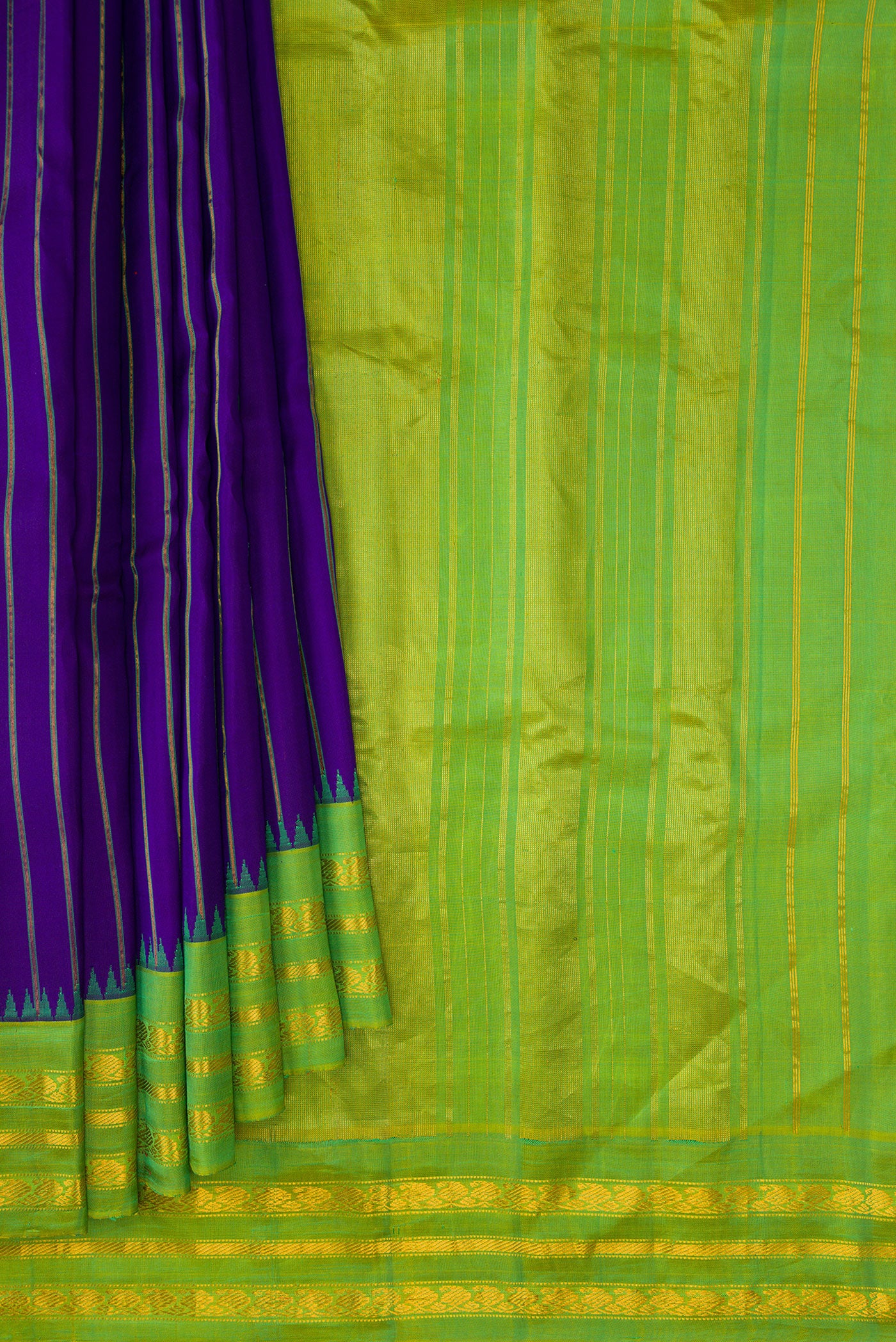 Pleats and pallu of Royal Blue Dual Tone Gadwal Silk Saree with Stripes on the body and Zari Border. 