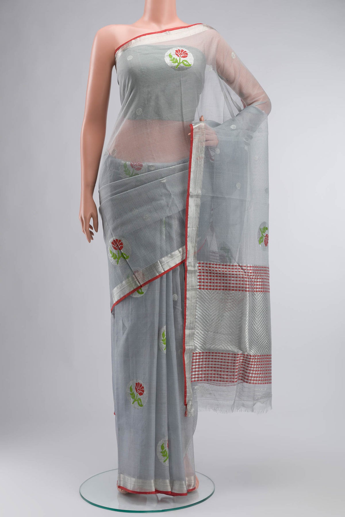 Grey Kota Silk Saree with Zari And Thread Butta on the body and Zari Border displayed on a mannequin