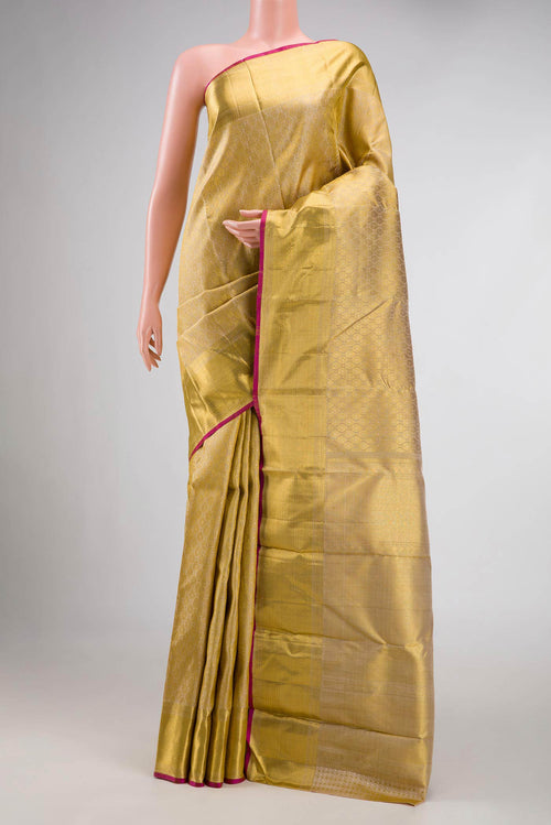 Beige Dual Tone Kanchipuram Silk Saree with Zari Brocade on the body and Zari Border displayed on a mannequin