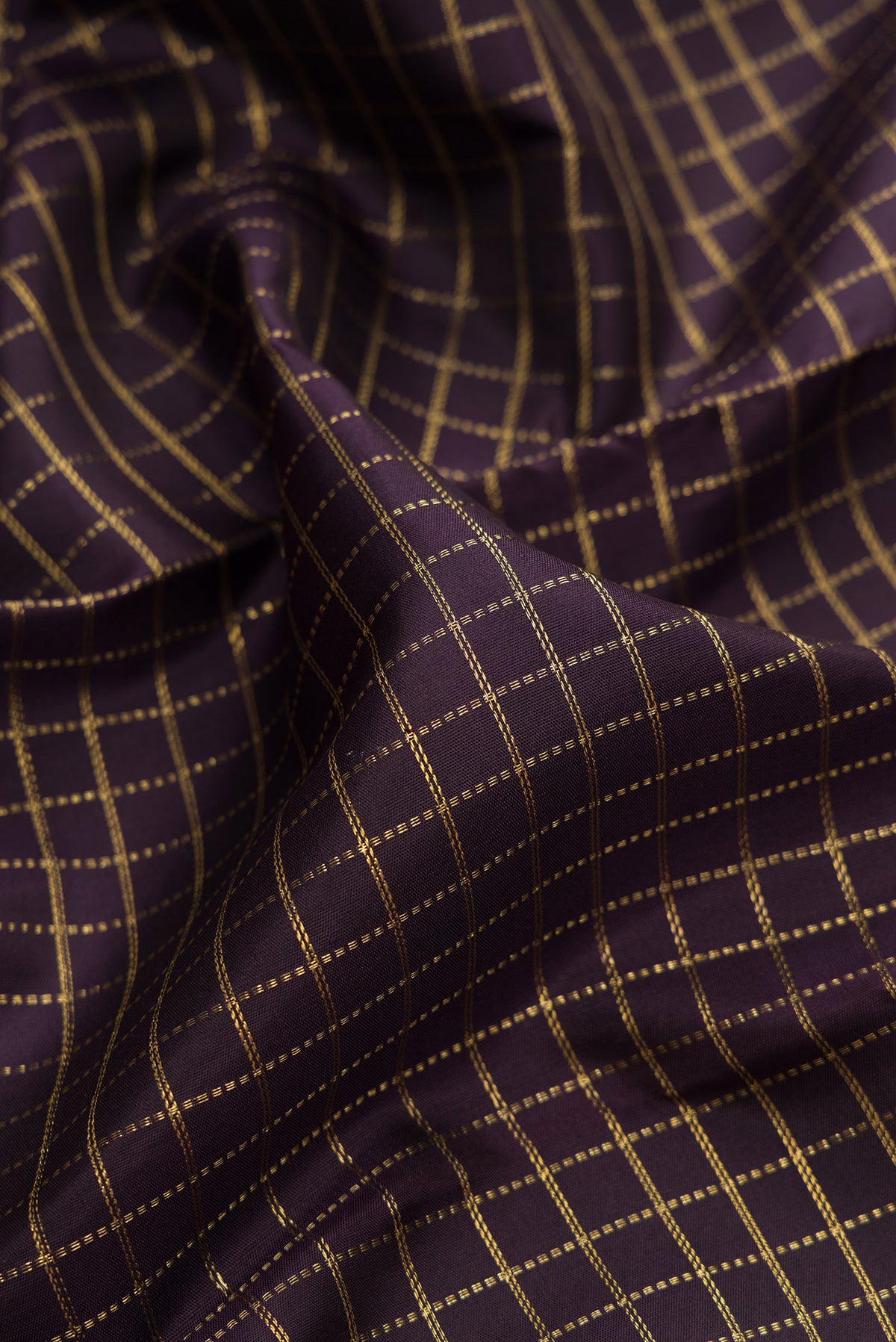 Close up of Pure Silk Pure Zari Coffee Brown Kanjivaram Saree with Checked design on the body and Paithani Border.  displaying folds