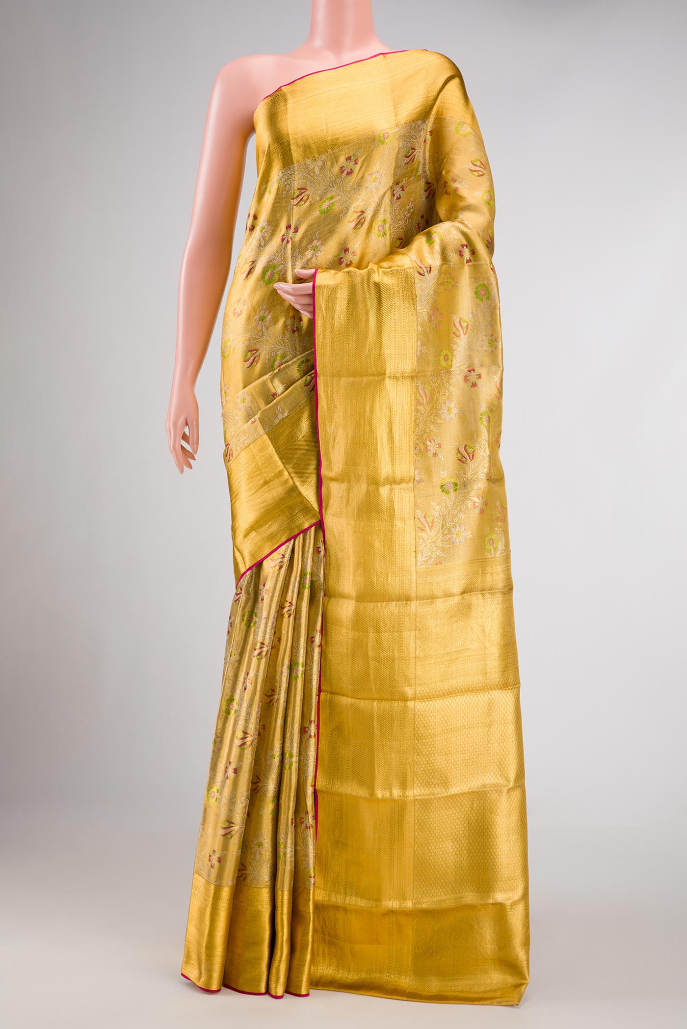 Gold Dual Tone Kanjivaram Tissue Silk Saree with Zari Brocade on the body and Zari Border.  displayed on a mannequin