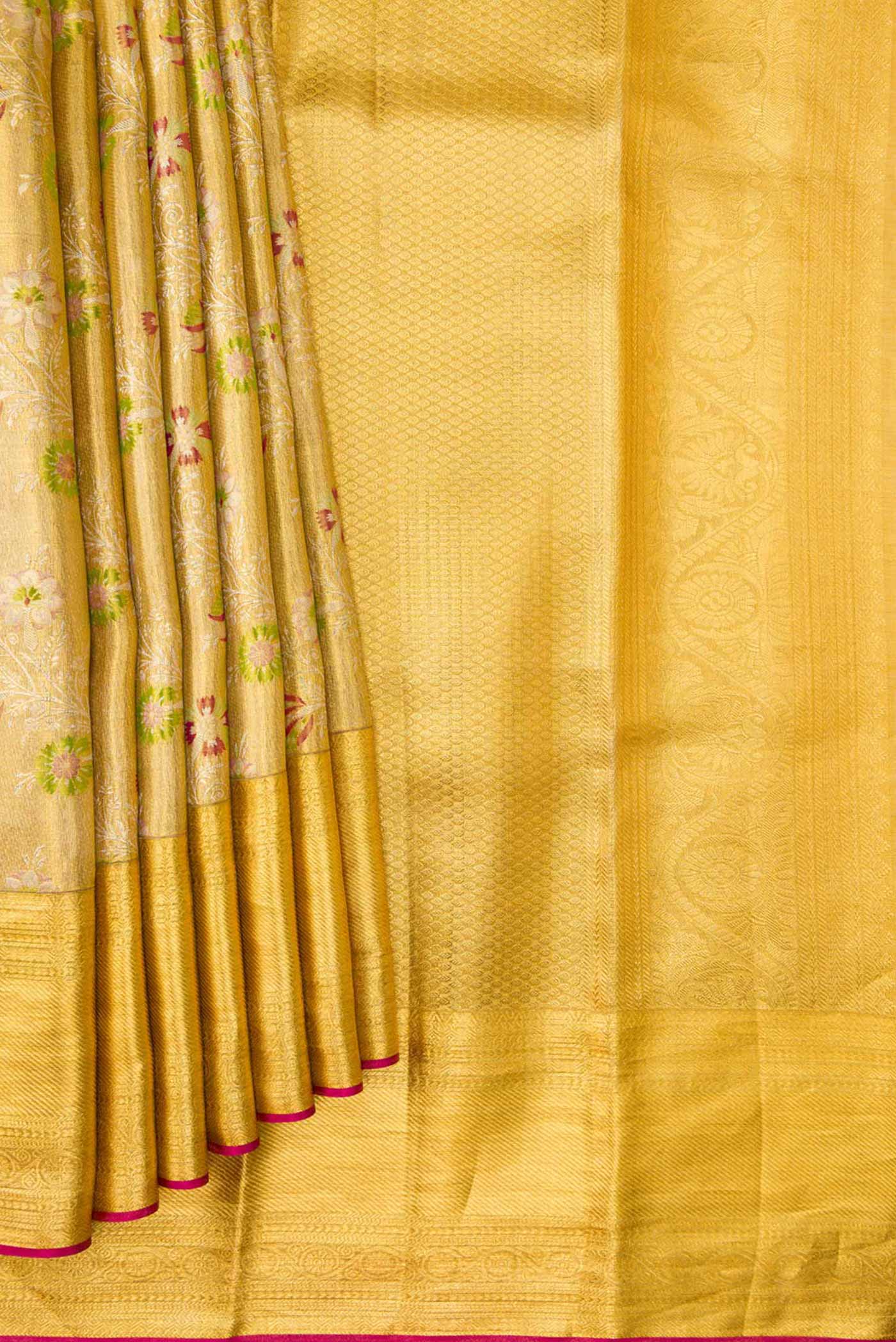 Pleats and pallu of Gold Dual Tone Kanjivaram Tissue Silk Saree with Zari Brocade on the body and Zari Border. 