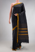 Black Kanjivaram Silk Saree with Plain Body and Thread Border.  displayed on a mannequin